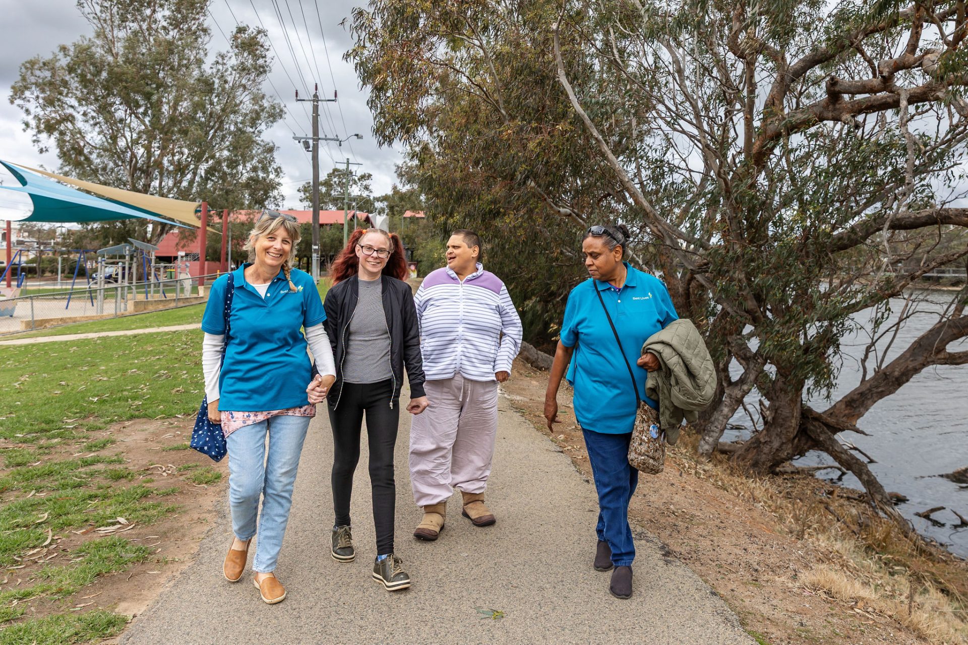 A group of people walking outdoors