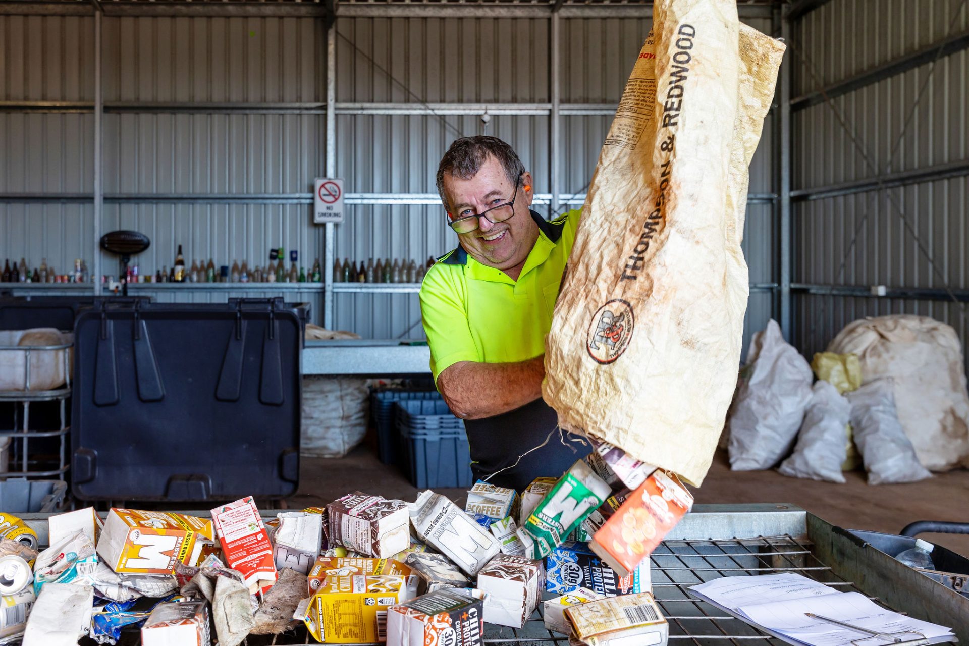 A gentleman working at the Containers for Change facility