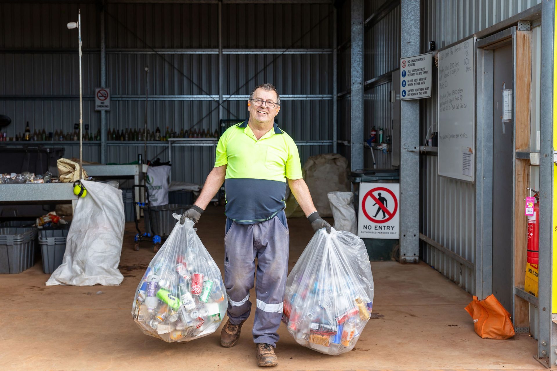 A gentleman working at the Containers for Change facility